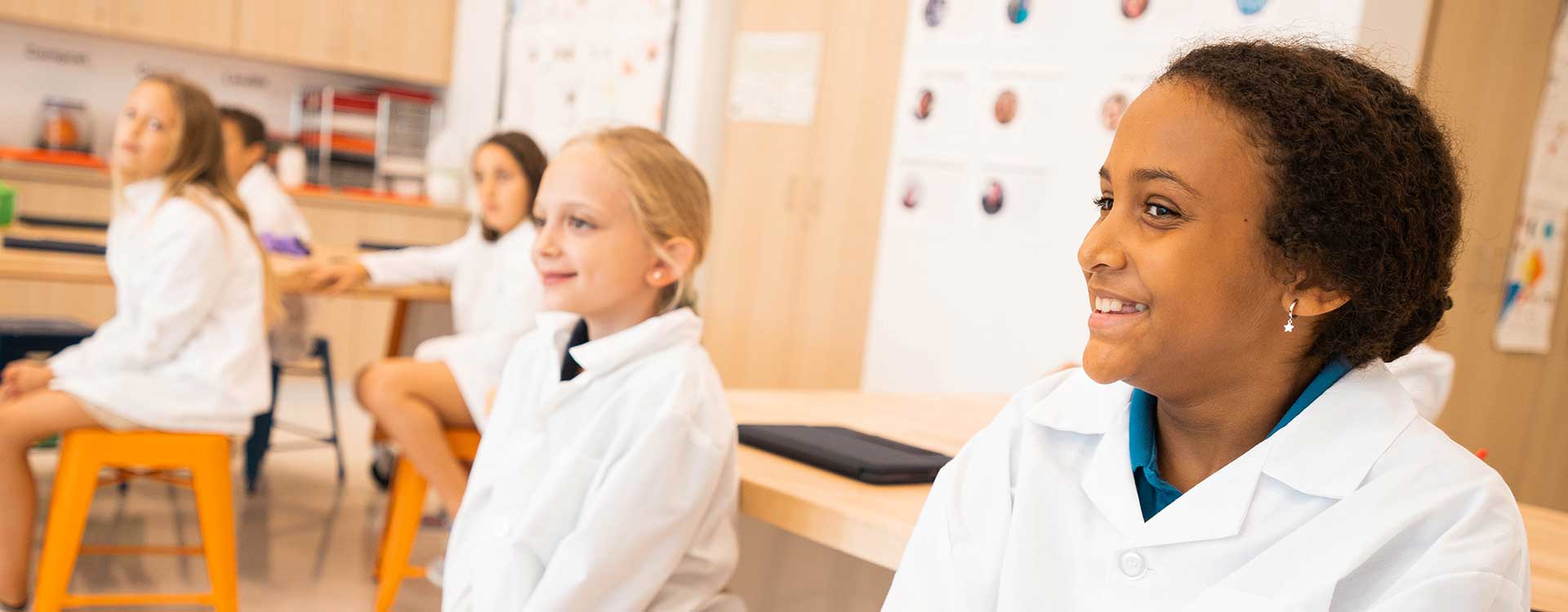Children in labcoats for science class