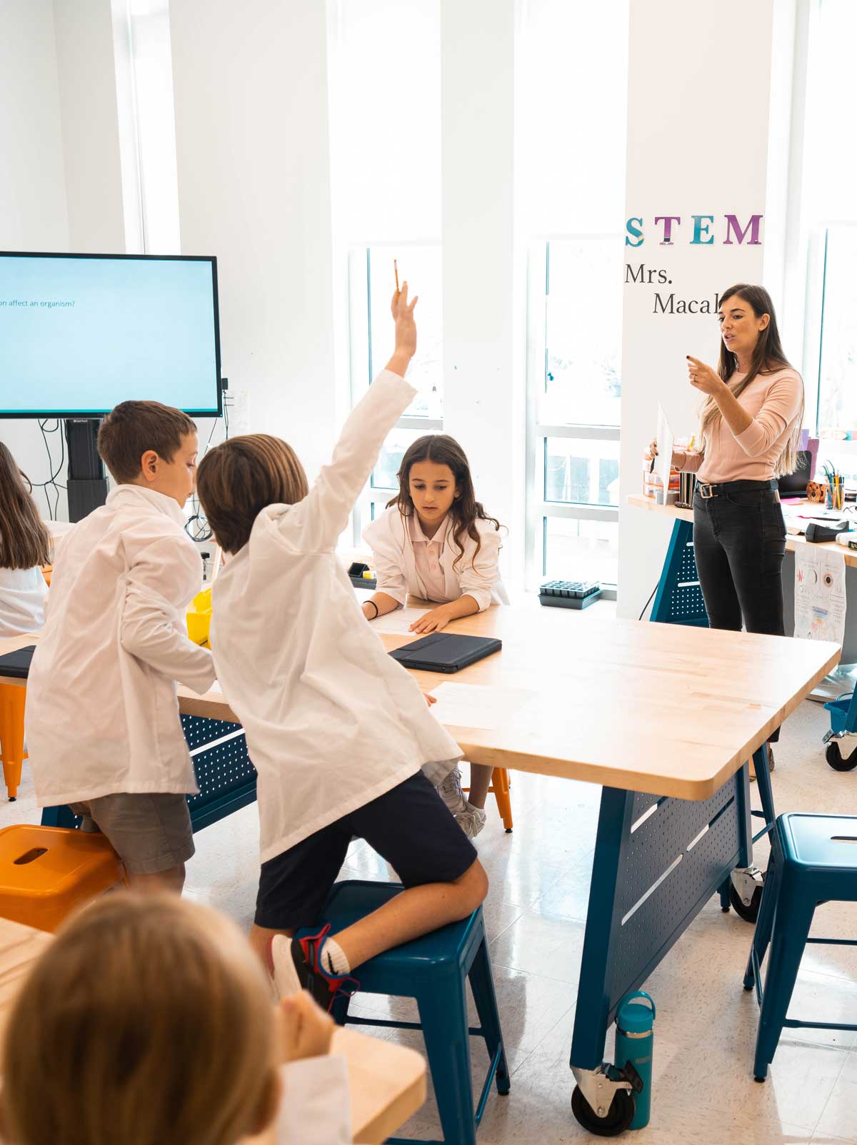 teacher calling on student in STEM class