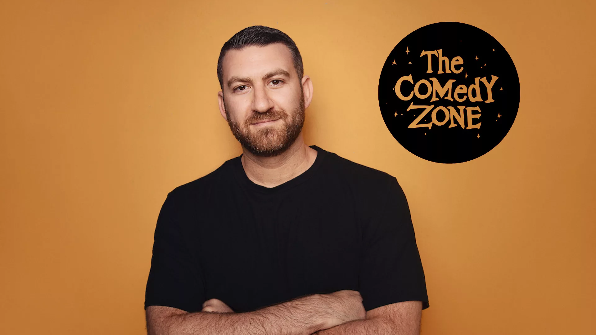 The Comedy Zone, Noah Gardenswartz in black shirt arms crossed