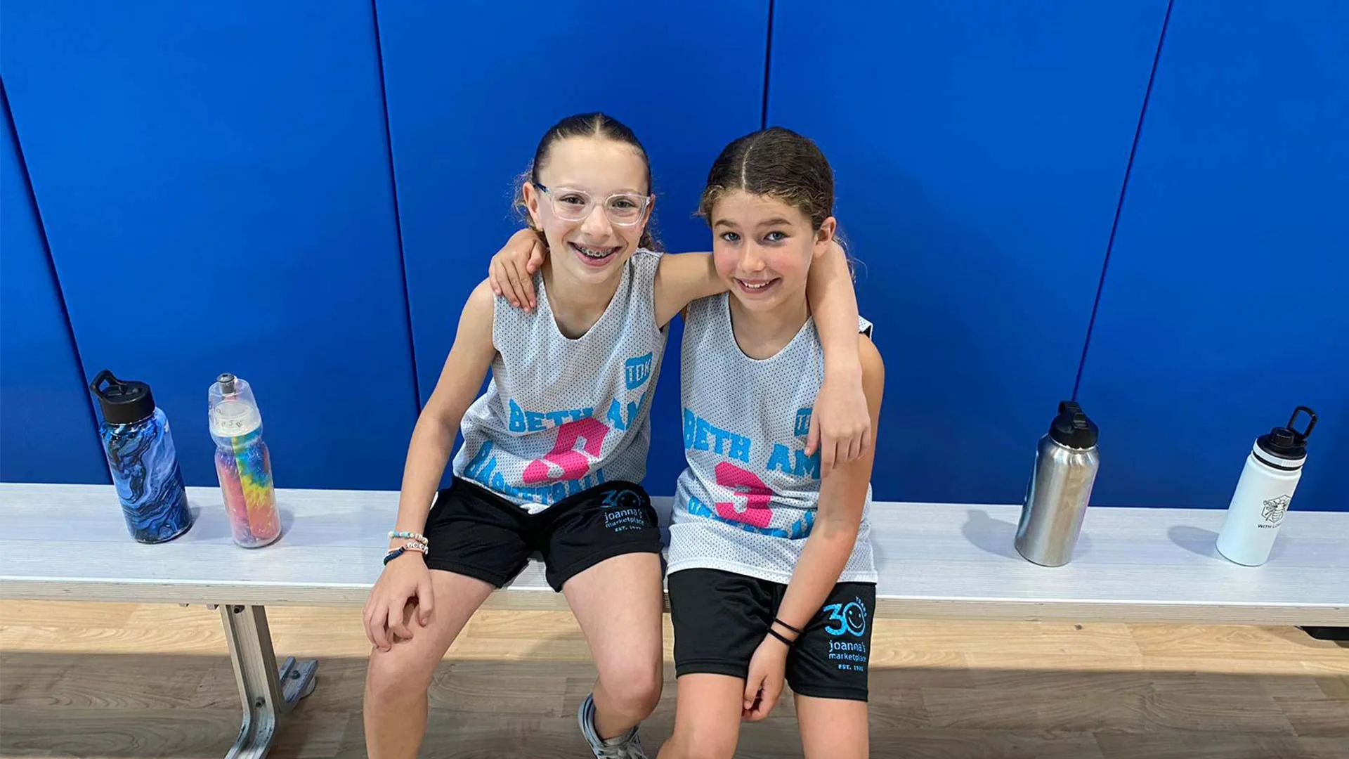 Two Girl hug court side