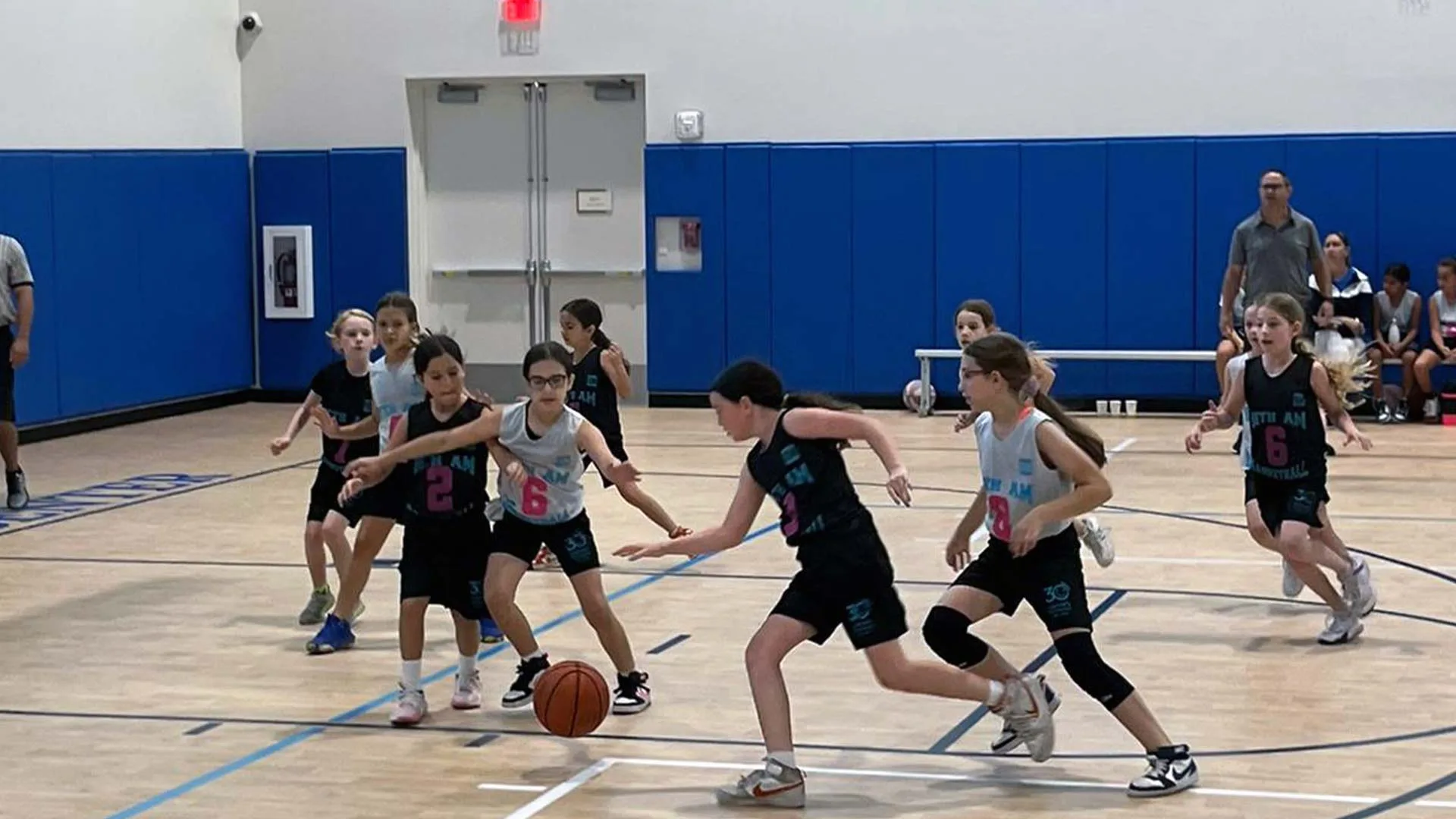 Girls play basketball