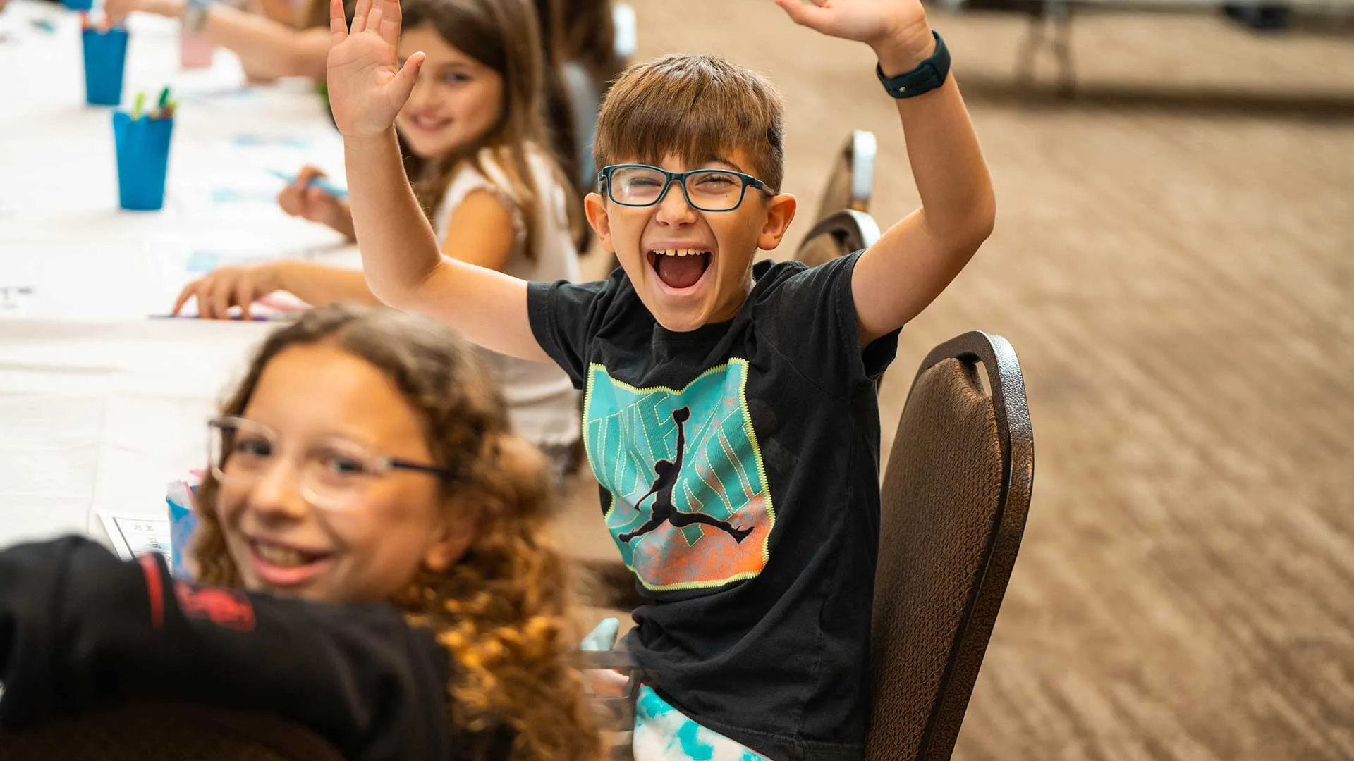 Young boy excited to be at a Youth Event