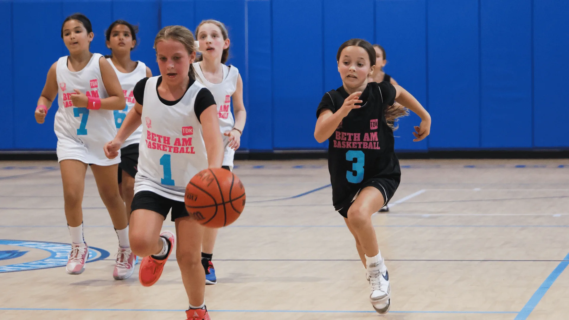 Girls playing basketball 